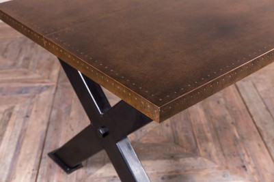 dudley-x-frame-dining-table-copper-top-close-up